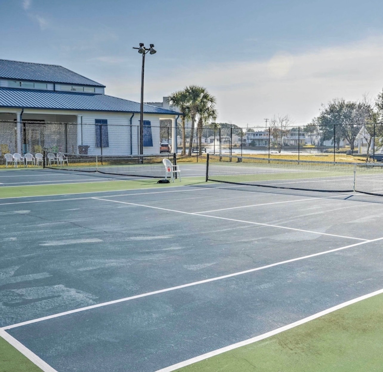 Tennis courts with waterfront views